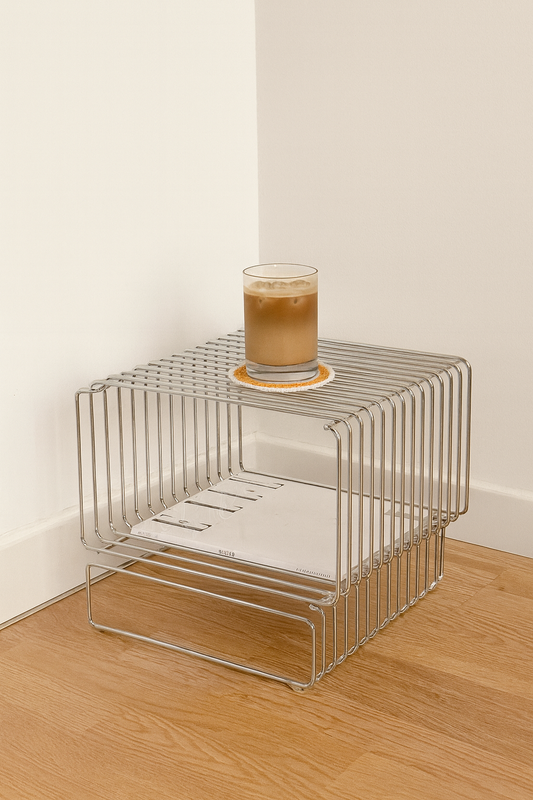 swirl coaster in pink and orange on a wire table with iced latte loopelle atelier